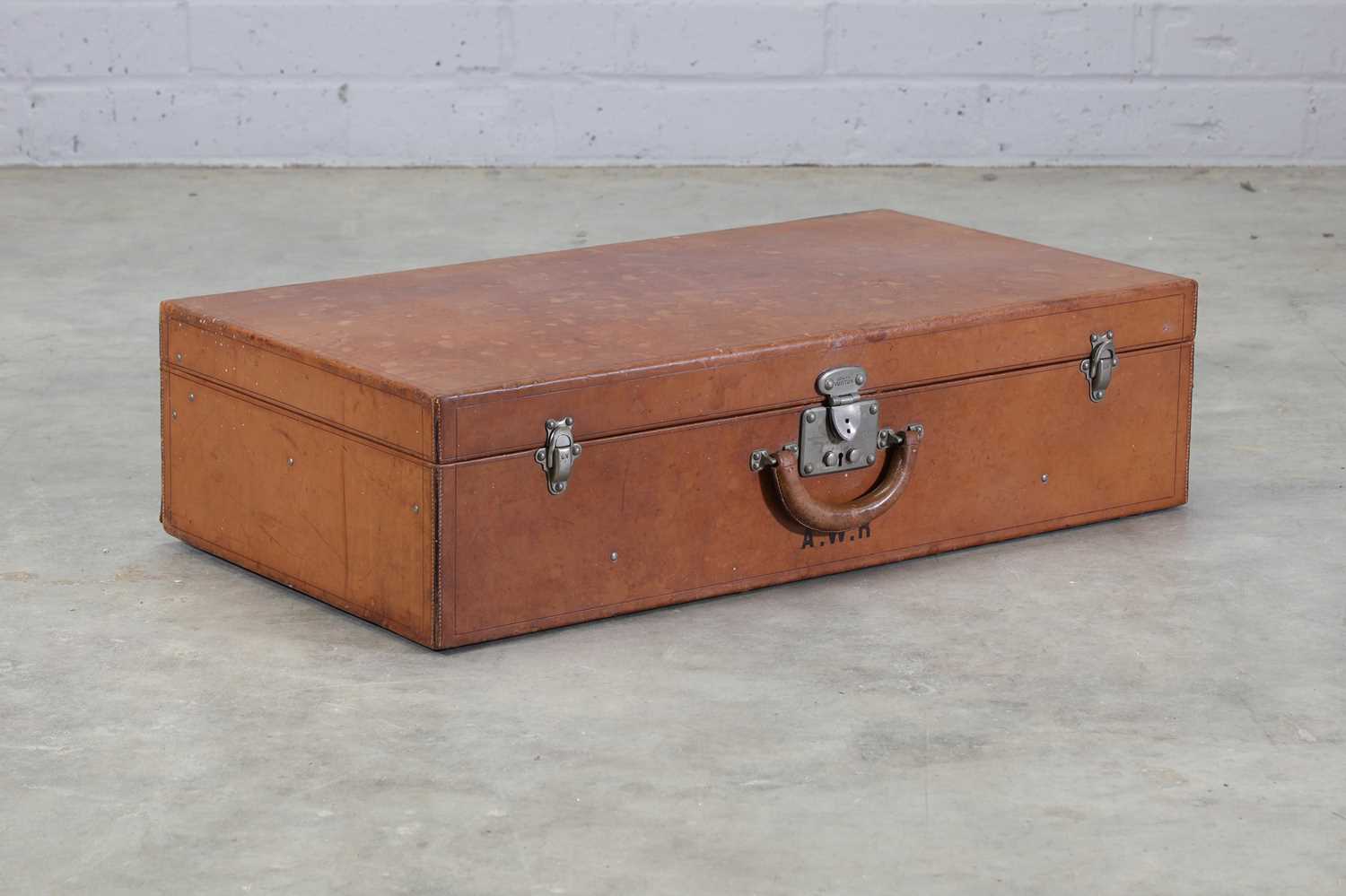 Lot 199 - A Louis Vuitton tan leather suitcase
