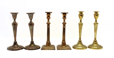 Lot 345 - Two pairs of Georgian brass candlesticks
