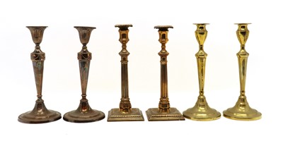 Lot 345 - Two pairs of Georgian brass candlesticks