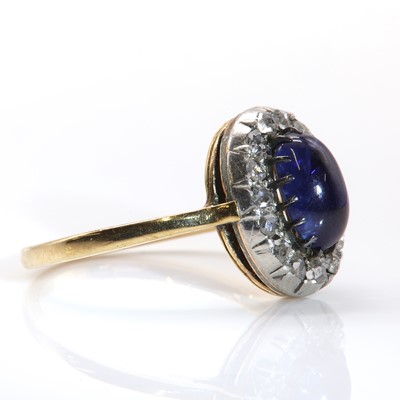 Lot 90 - A sapphire and diamond oval cluster ring