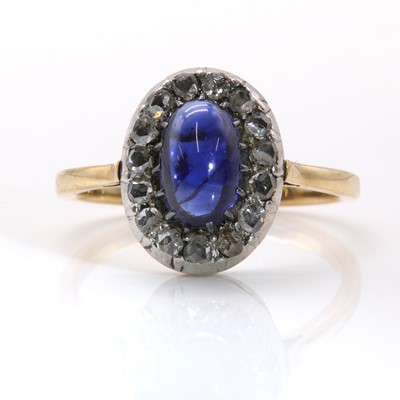 Lot 90 - A sapphire and diamond oval cluster ring