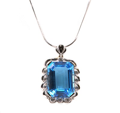 Lot 457 - A Continental blue topaz and diamond pendant and earring matched suite