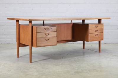 Lot 419 - A Danish teak desk