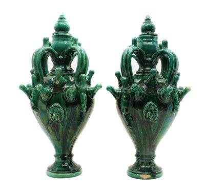 Lot 256 - A pair of green glazed stoneware urns