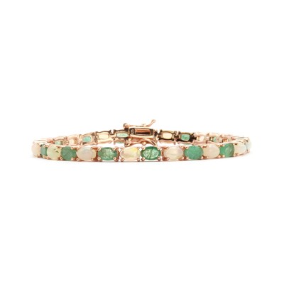 Lot 125 - A silver gilt emerald and opal bracelet