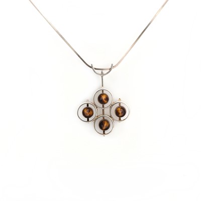 Lot 25 - A Finnish silver tiger's eye pendant, signed Kultaseppä Salovaara