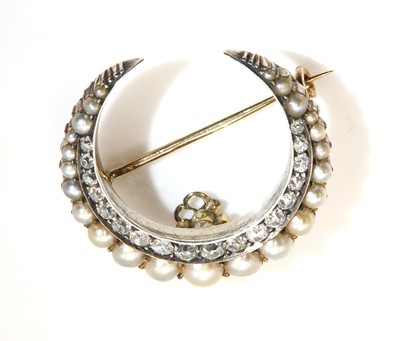 Lot 96 - A Victorian split pearl and diamond crescent brooch/hair ornament