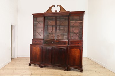 Lot 394 - A George III-style mahogany breakfront library bookcase
