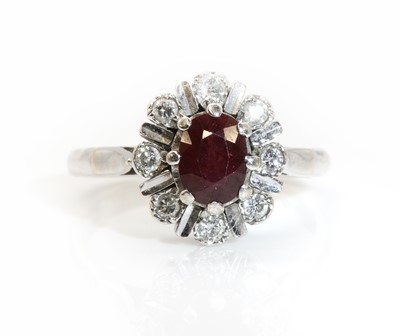 Lot 268 - An 18ct white gold ruby and diamond cluster ring