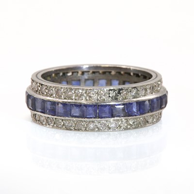 Lot 300 - A three row sapphire and diamond full eternity ring