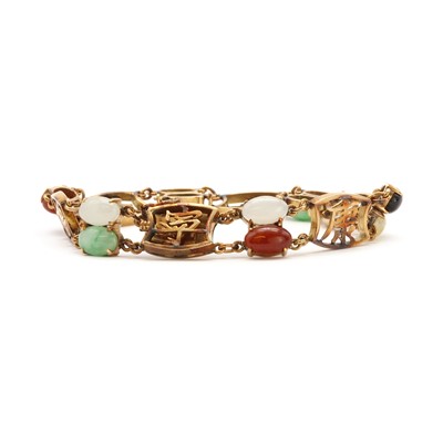 Lot 146 - A vari-colour jade panel bracelet