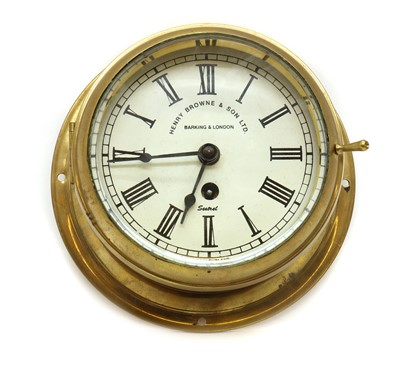 Lot 304 - A brass bulkhead clock