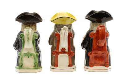 Lot 159 - A group of three pottery Toby jugs