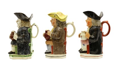 Lot 159 - A group of three pottery Toby jugs