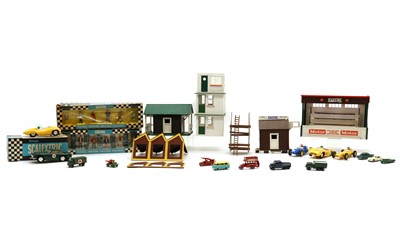 Lot 282 - A collection of Tri-Ang Scaletrix model cars and figures