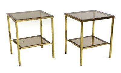 Lot 425 - A pair of two tiered brass side tables