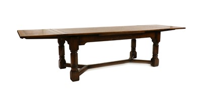 Lot 390 - An oak farmhouse draw leaf refectory table