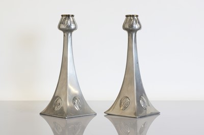 Lot 119 - A pair of WMF Secessionist pewter candlesticks