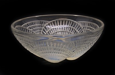 Lot 283 - A Lalique 'Coquilles' opalescent glass bowl