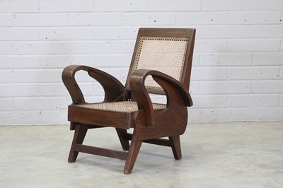 Lot 303 - A teak and cane armchair