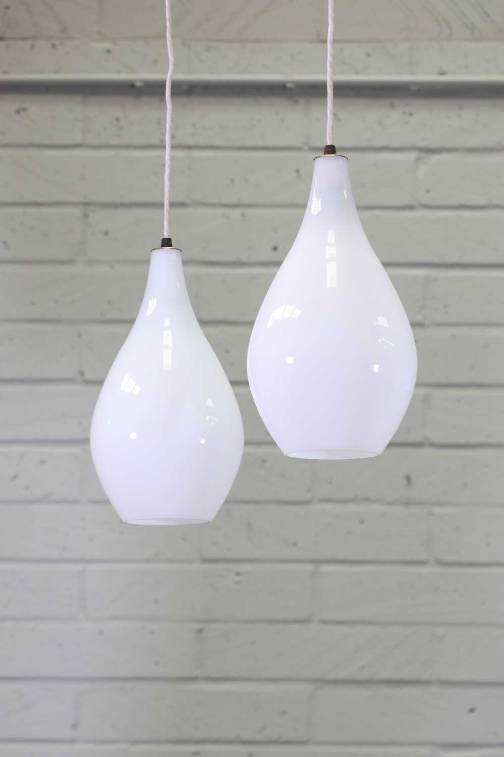 Lot 376 A pair of Danish glass pendant lights,