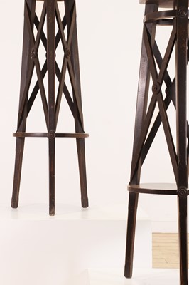 Lot 362 - A pair of ebonised wooden sculpture stands