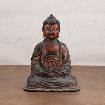 Lot 214 - A Chinese gilt-lacquered bronze Buddha