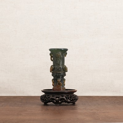 Lot 111 - A Chinese hardstone gu vase