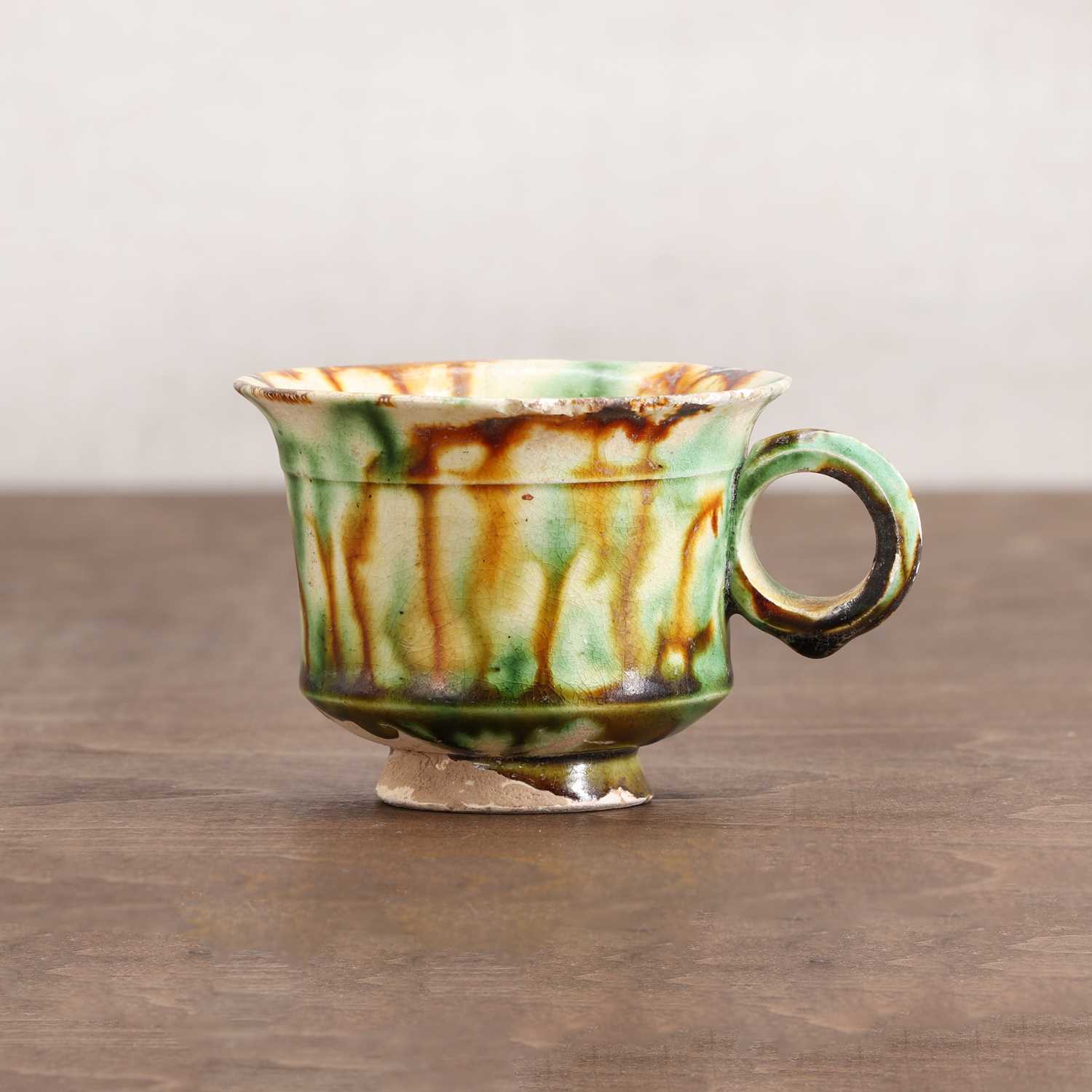 Lot 19 - A Chinese sancai-glazed cup