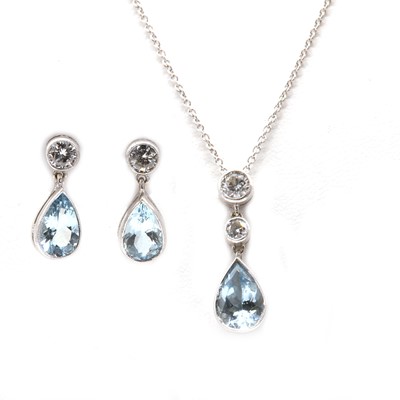 Lot 360 - A white gold aquamarine and diamond pendant and earring suite