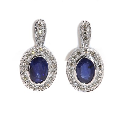 Lot 294 - A pair of Continental sapphire and diamond oval drop earrings