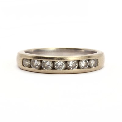 Lot 31 - An 18ct white gold half eternity ring