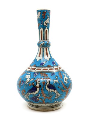 Lot 210 - An Iznik porcelain bottle vase