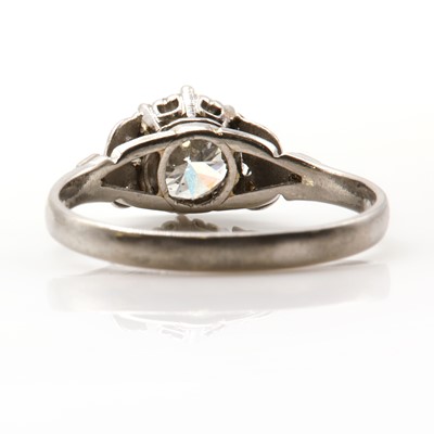 Lot 422 - A single stone diamond ring with diamond set shoulders