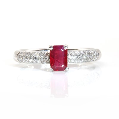 Lot 320 - A platinum single stone ruby ring with pavé set diamond shoulders, by Disdale and Ellis c.2006