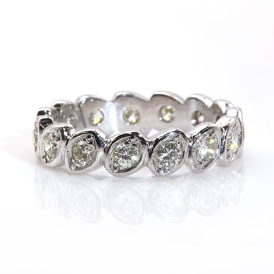 Lot 309 - A diamond set full eternity ring