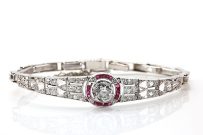 Lot 134 - A French Art Deco diamond and ruby target style bracelet, c.1925