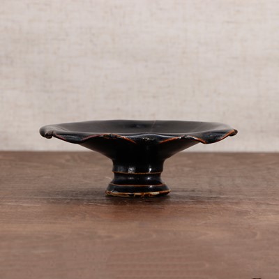 Lot 36 - A Chinese black-glazed stoneware stem cup