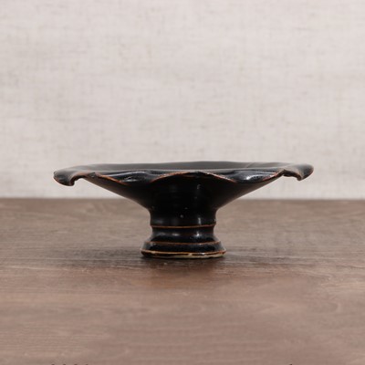 Lot 36 - A Chinese black-glazed stoneware stem cup