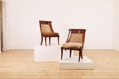 Lot 54 - A pair of Charles X mahogany low chairs