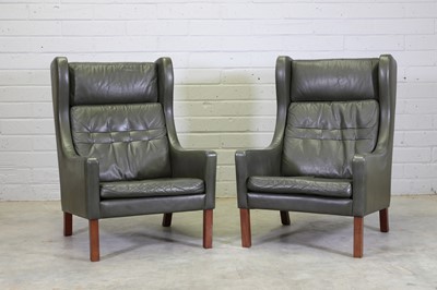 Lot 374 - A pair of Danish wing-backed armchairs