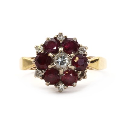 Lot 58 - An 18ct gold ruby and diamond target cluster ring