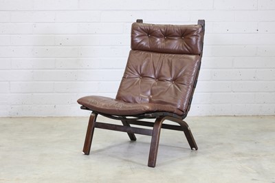 Lot 355 - A Danish stained beech lounge chair