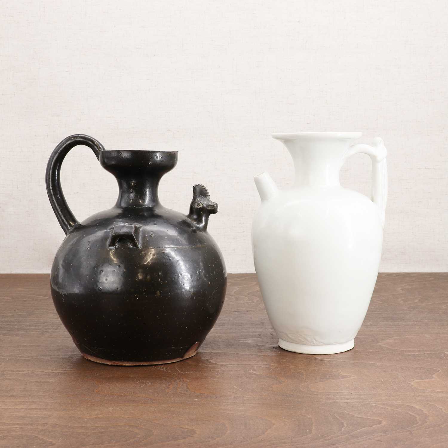 Lot 4 - A Chinese black-glazed ewer