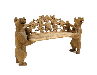 Lot 322 - A carved teak hall bench in the Black Forest-style
