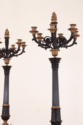 Lot 265 - A pair of large gilt and patinated bronze candelabra
