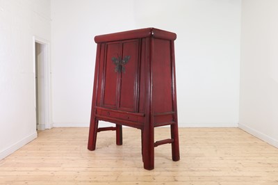 Lot 347 - A Chinese red-lacquered marriage cabinet