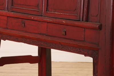 Lot 347 - A Chinese red-lacquered marriage cabinet