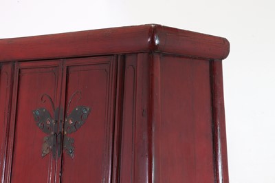 Lot 347 - A Chinese red-lacquered marriage cabinet