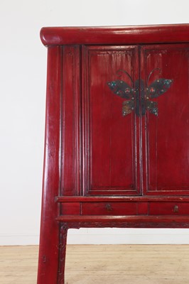 Lot 347 - A Chinese red-lacquered marriage cabinet